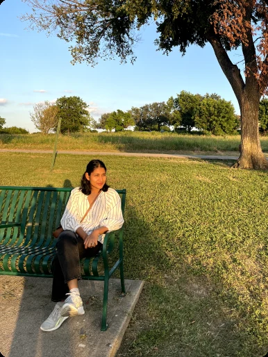 Kajal Jain sitting outdoors on a bench