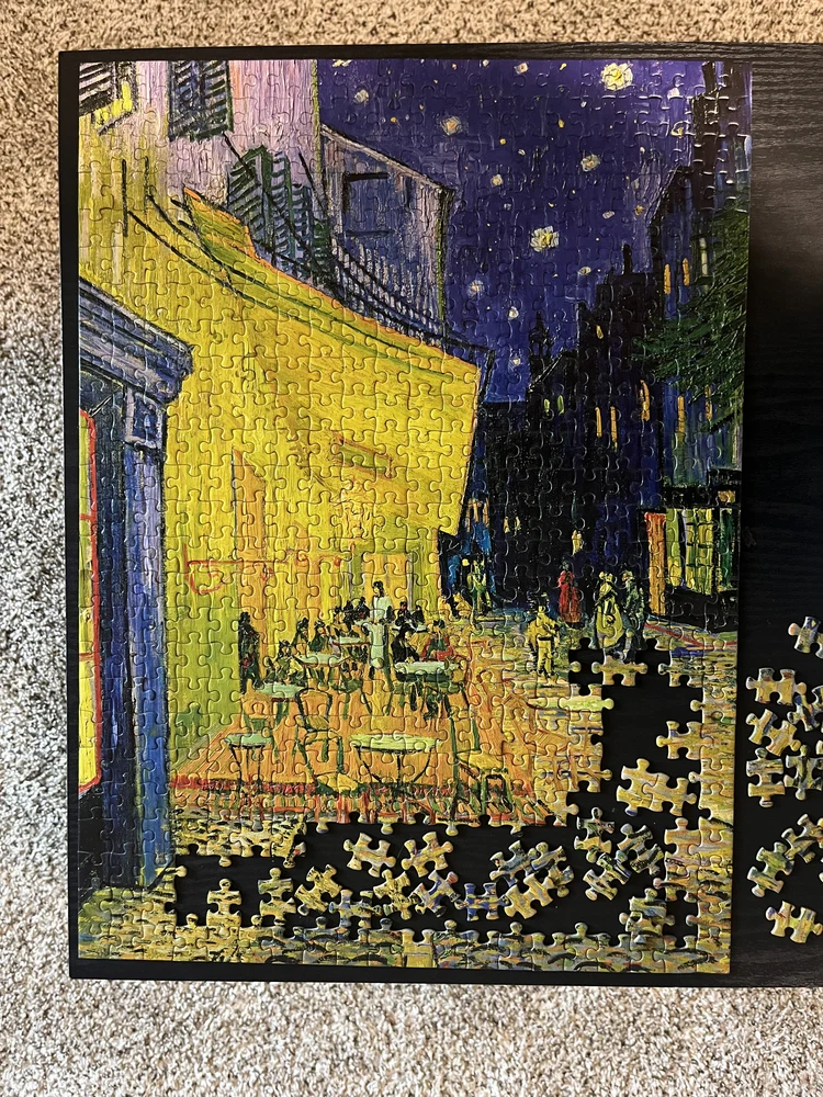 A partly completed jigsaw puzzle of a Van Gogh painting